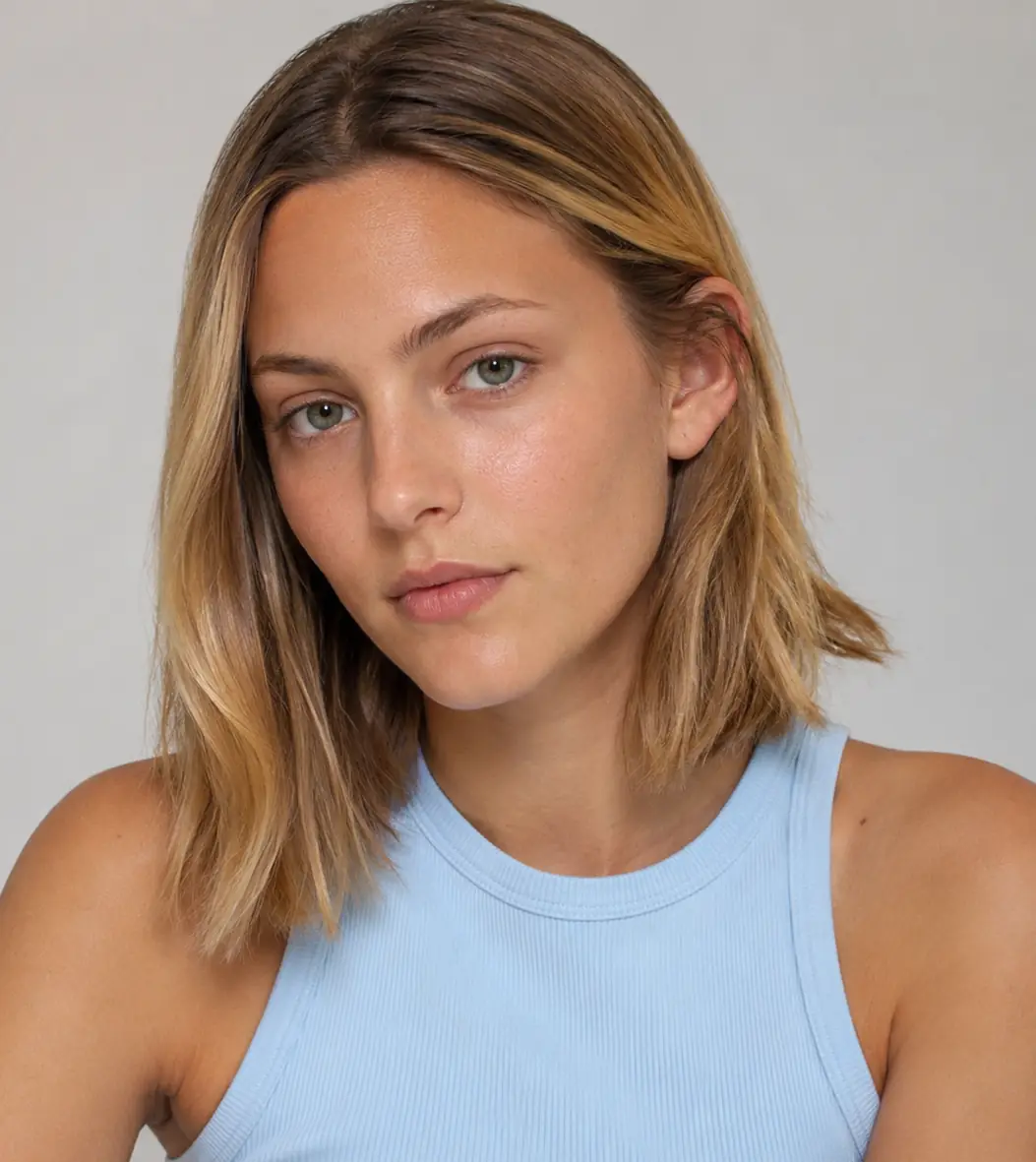 Layered lob with soft balayage brightening the ends for grow-out-friendly dimension