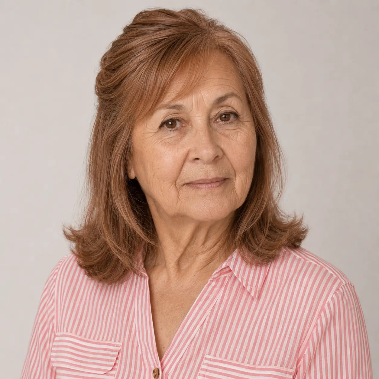 Soft, smooth, and timeless, this lob keeps its shape without demanding much effort on a woman over 70