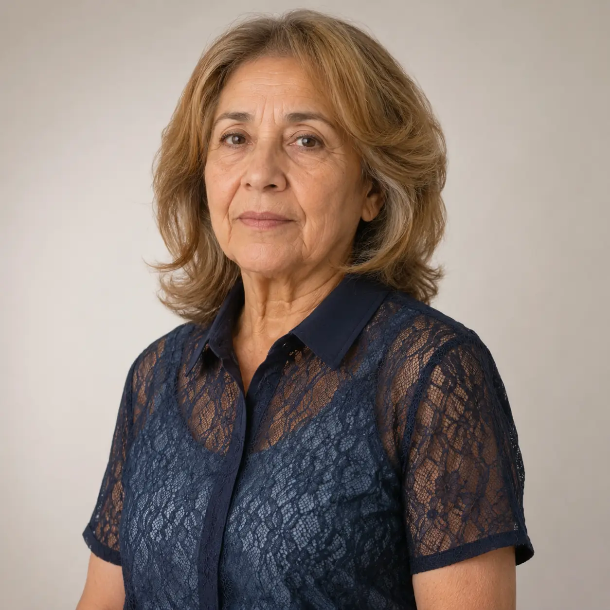 A warm brown-auburn layered bob with body looks youthful and full of life on a woman over 70