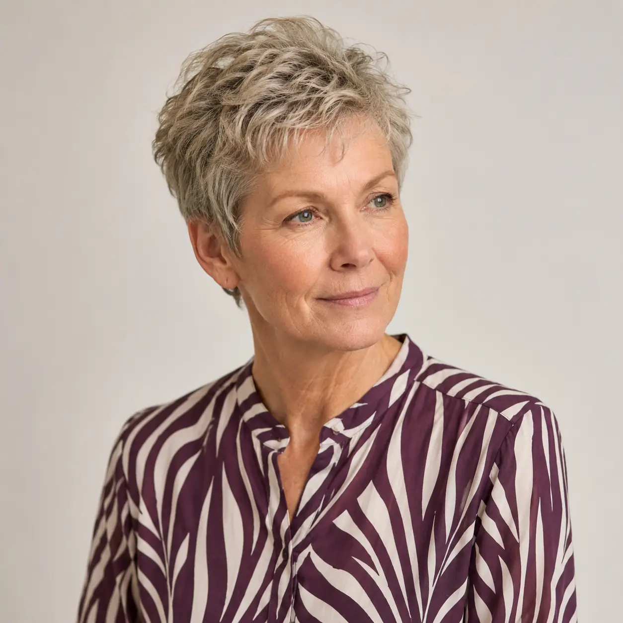 Light layers and gentle texture make this pixie effortless to style on a woman over 70